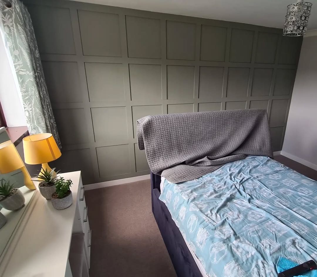 Dark panelled bedroom